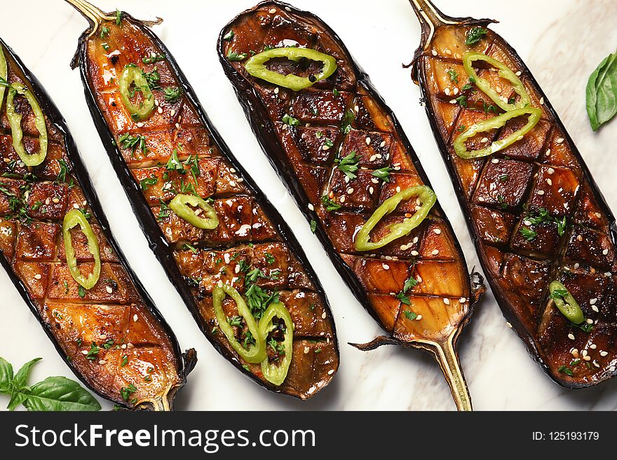 Fried eggplant slices with chili peppers