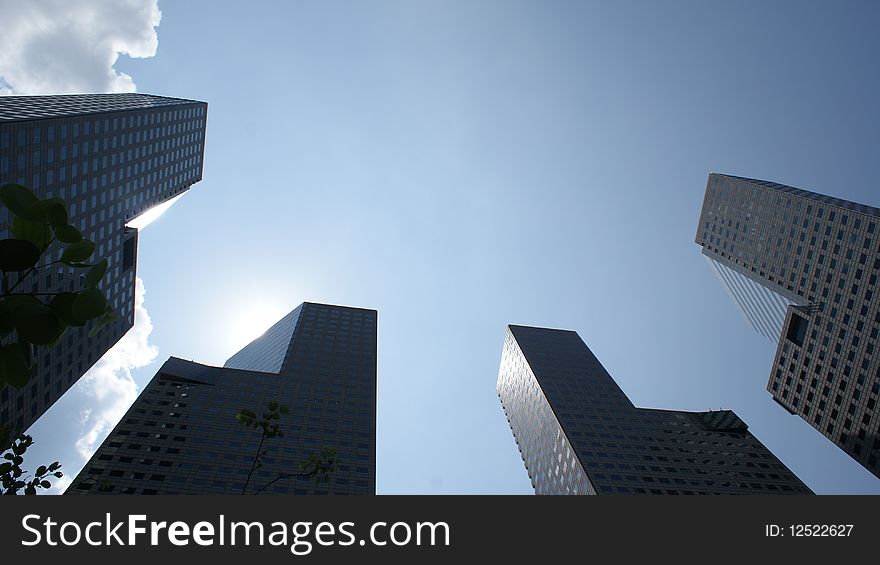 Peering into the sky between the Suntec Towers in Singapore. Peering into the sky between the Suntec Towers in Singapore