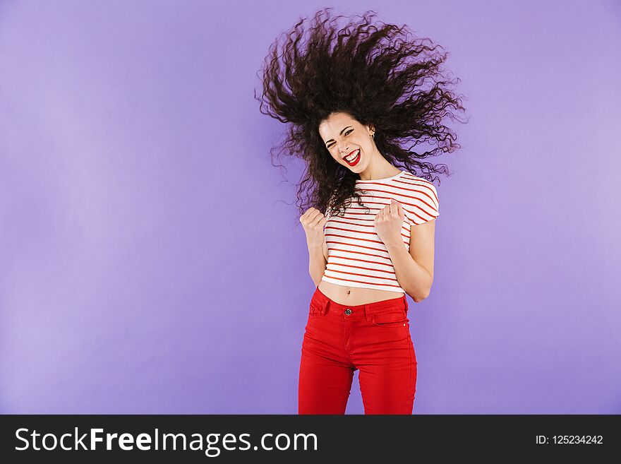 Portrait Of A Pretty Young Casual Woman Jumping