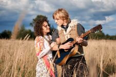 Free Boho Style Attractive Couple In Love Posing On The Autumn Field. Stock Photos - 125258183