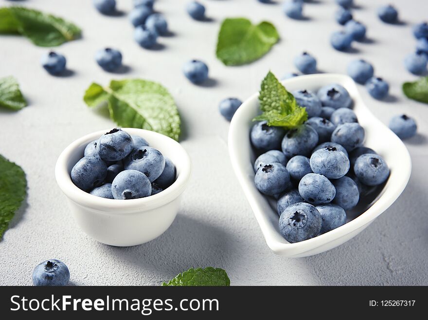 Juicy blueberries and green leaves