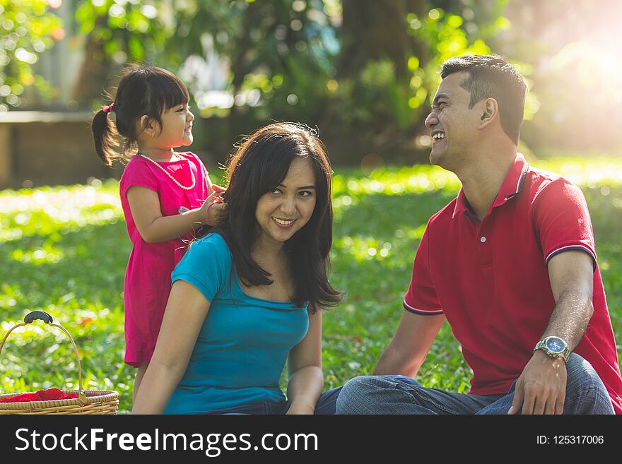 Happy family having a good morning in a park. Happy family having a good morning in a park