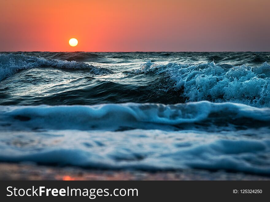 Sea wave close up, low angle view, sunrsie shot. Sea wave close up, low angle view, sunrsie shot