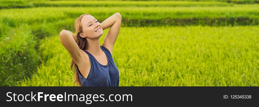 Young woman on Green cascade rice field plantation. Bali, Indonesia BANNER, long format