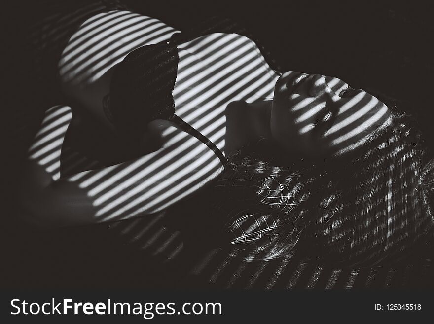 Girl with shadows in underwear
