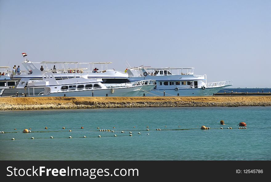 White yachts near the beach in Red sea