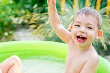Children Playing In Inflatable Baby Pool. Kids Swim And Splash Royalty Free Stock Images