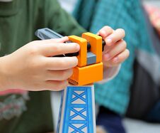 Child Playing With Toy Crane Stock Image