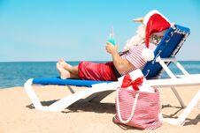 Authentic Santa Claus With Cocktail Resting On Lounge Chair Stock Image