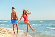 Happy Young Couple Having Fun At Beach Stock Images