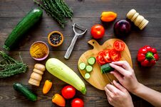 Cut Different Fresh Vegetables On Cutting Board For Cooking Vegetable Stew. Dark Wooden Background Top View Stock Photo Cut Different Fresh Vegetables On Cutting Board For Cooking Vegetable Stew. Dark Wooden Background Top View Stock Photo
