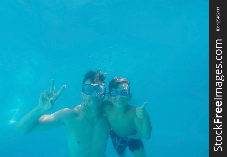 Father and son underwater