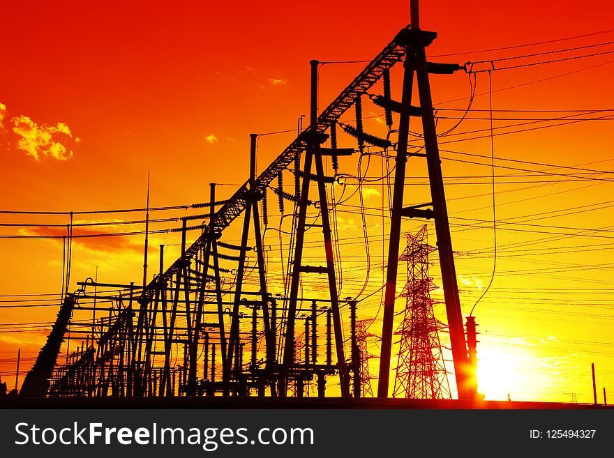 The silhouette of the evening high voltage substations. The silhouette of the evening high voltage substations