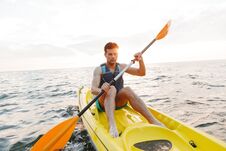 Handsome Man Kayaking On Lake Sea In Boat. Royalty Free Stock Photos