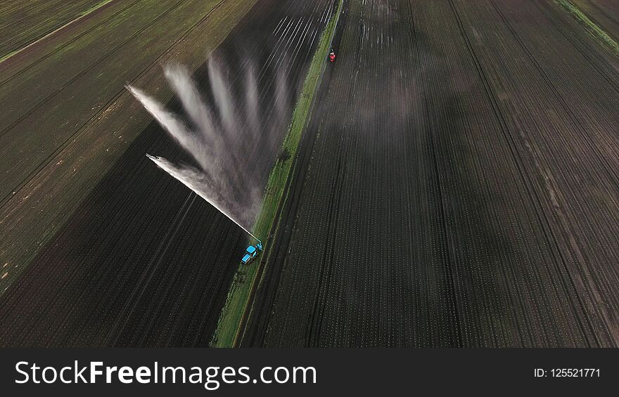 Aerial view:Irrigation system watering a farm field.