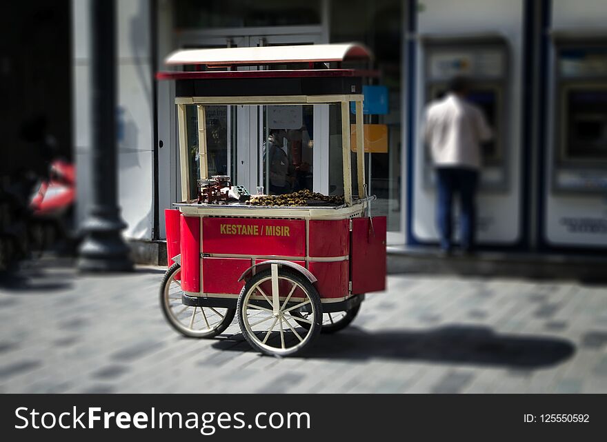 Street cart of fast food with boiled and grilled corn and chestnut