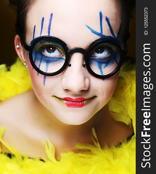 close up of a face of a girl with creative visage. close up of a face of a girl with creative visage