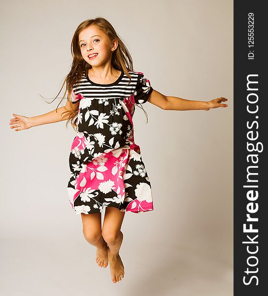 Little girl jumping of joy