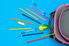 A Lot Of Colored Pencils And A School Bag On Light Blue Background. The View From The Top. Royalty Free Stock Photography A Lot Of Colored Pencils And A School Bag On Light Blue Background. The View From The Top. Royalty Free Stock Photography