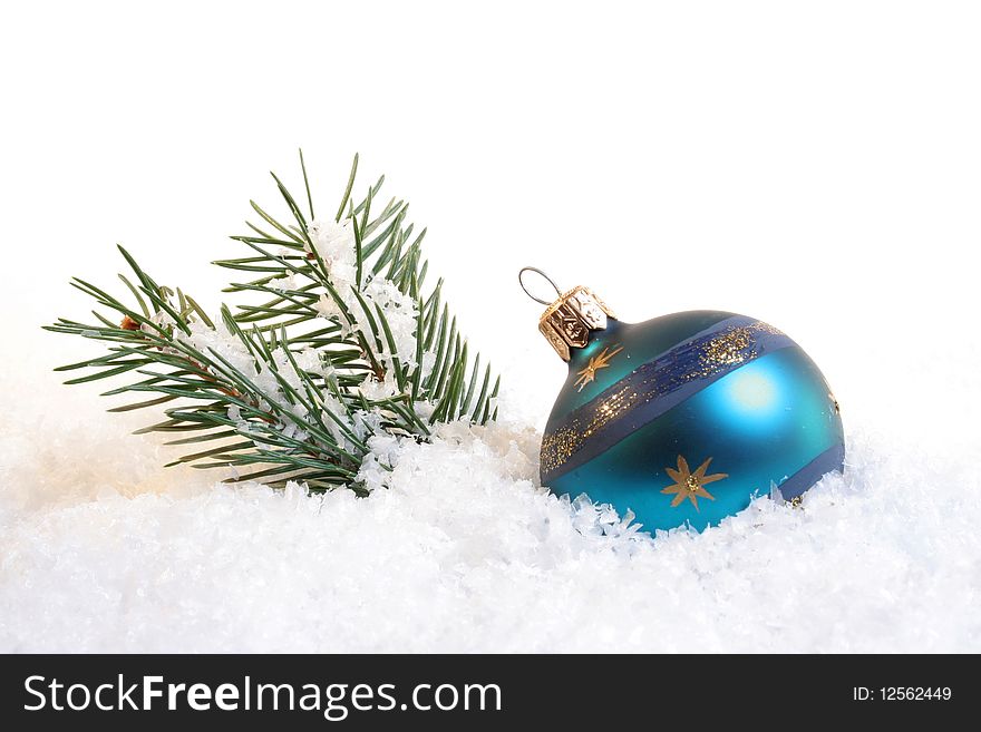 Christmas ball in snow with fir