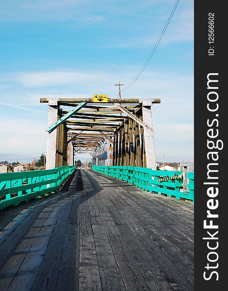 Wooden trestle bridge against blue sky