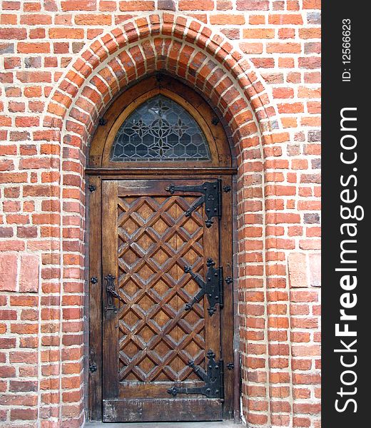 View on ghotic door in the brick wall