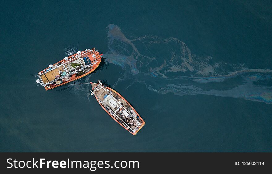 Aerial view taken by drone of fishing boats polluting environment in Malaysia. Aerial view taken by drone of fishing boats polluting environment in Malaysia.