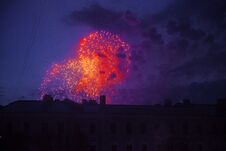 Colorful Bright Fireworks On Roof Top Silhouette, Magic Holiday Stock Photo