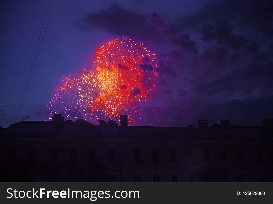 Colorful bright fireworks on roof top silhouette, magic holiday