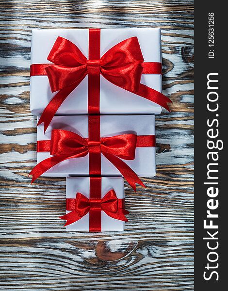 Set Of Red Packed Gift Boxes On Wooden Surface
