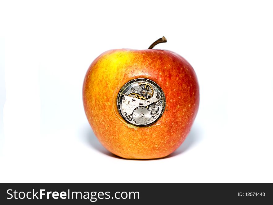 Apple with mechanisms inside on a white background. Apple with mechanisms inside on a white background