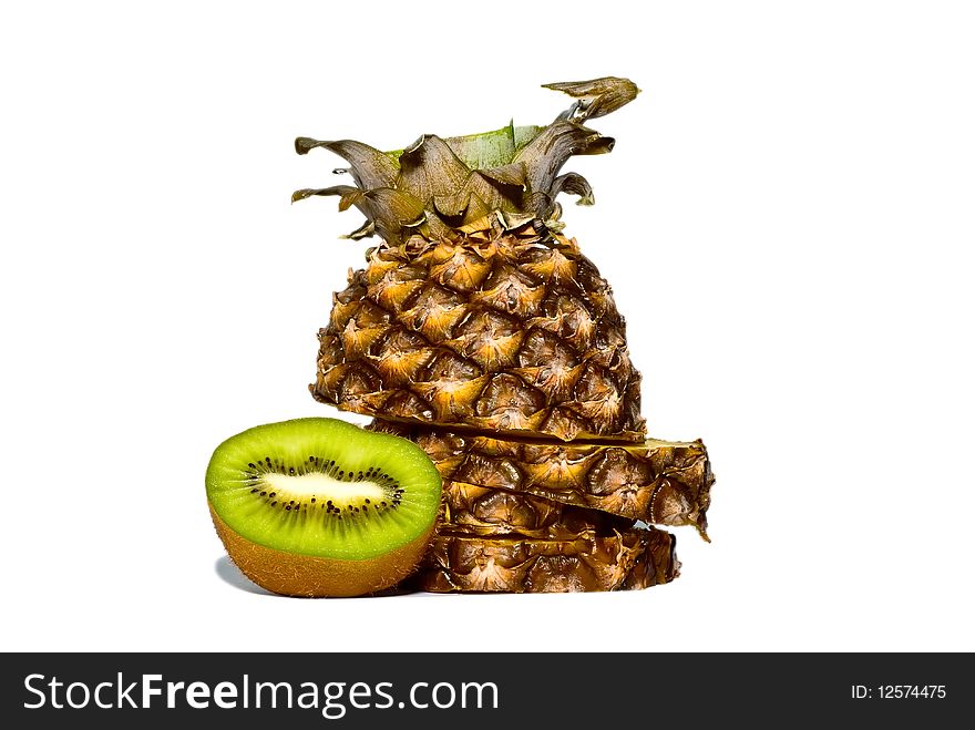 Slices of pineapple and kiwi on a white background