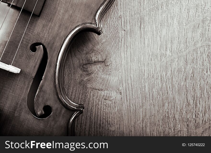 Violin on a wooden background. black and white. copy spaces.