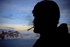 Silhouette Of Male Smokers Stock Photo