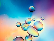 Clear Oil Drops On Water Surface Stock Photos