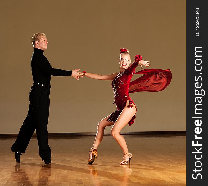 Latino Dance Couple In Action Preforming A Exhibition Dance - W