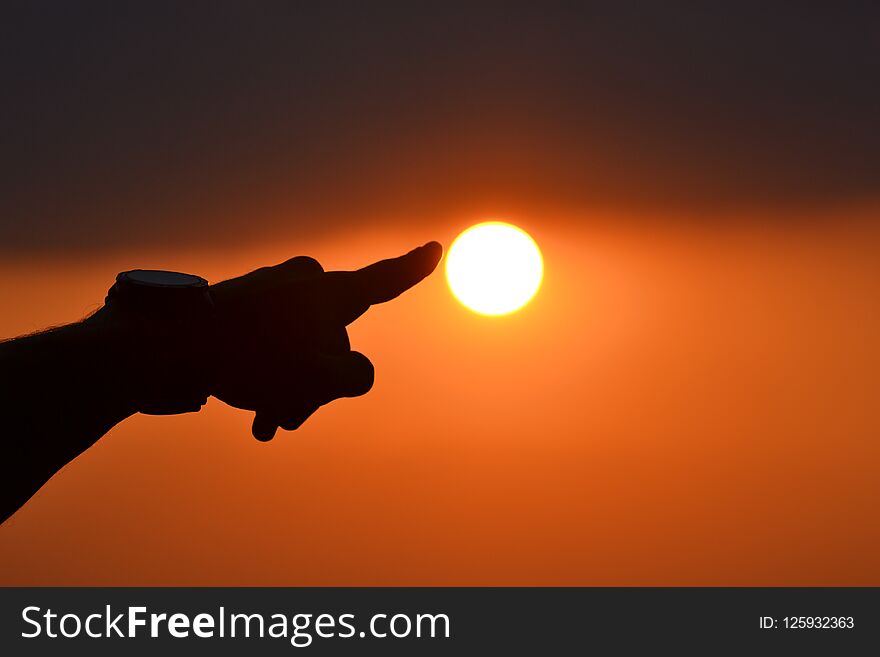 Man try to touch the sun. sunset in Serbia. Summer time. Man try to touch the sun. sunset in Serbia. Summer time