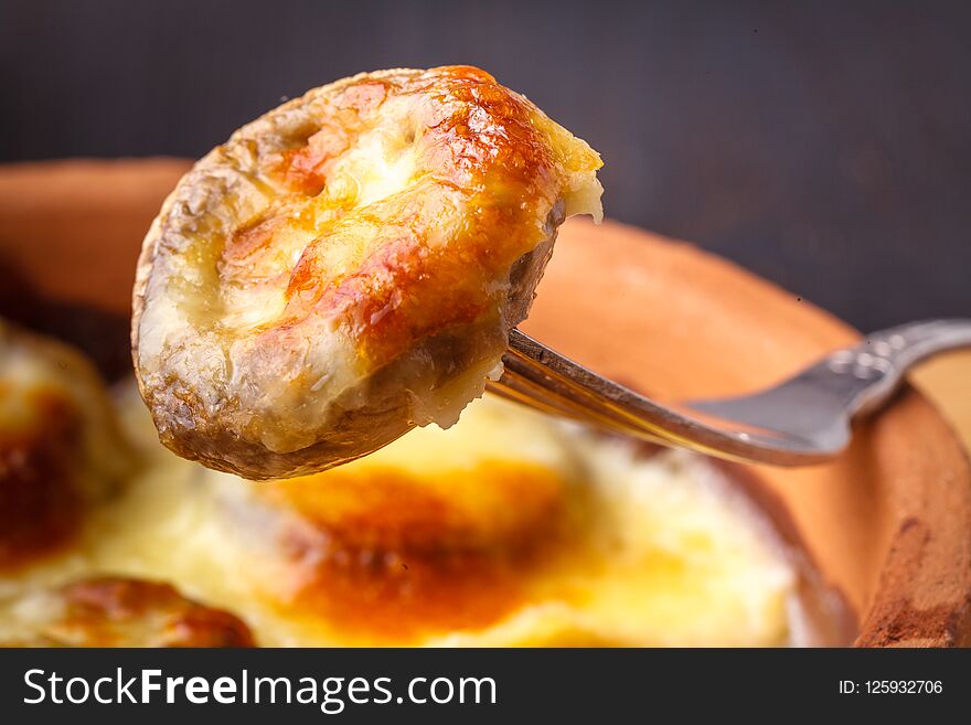 Mushroom julienne with cheese crust close up