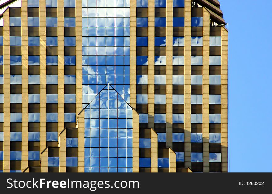 Chicago's Prudential Plaza II in golden afternoon light with cloud and sky reflection on its glass windows. Chicago's Prudential Plaza II in golden afternoon light with cloud and sky reflection on its glass windows