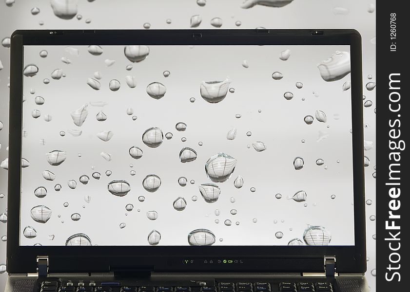 Notebook with rain drops on screen. Notebook with rain drops on screen