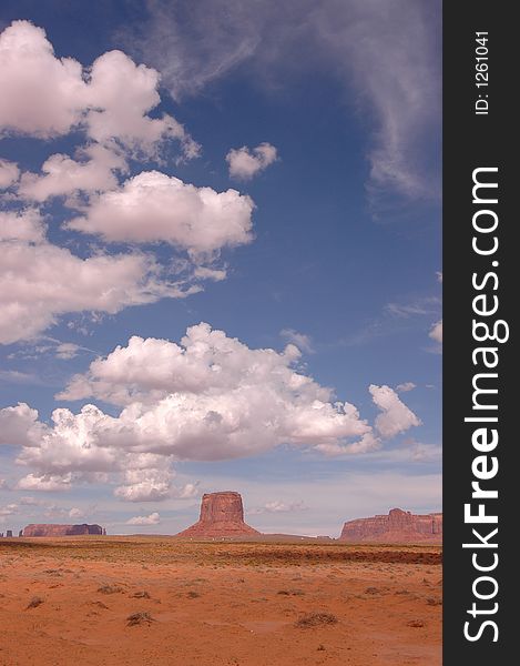 Towards the monument valley in the state of Utah..rock, clouds and a beautiful sky. Towards the monument valley in the state of Utah..rock, clouds and a beautiful sky.