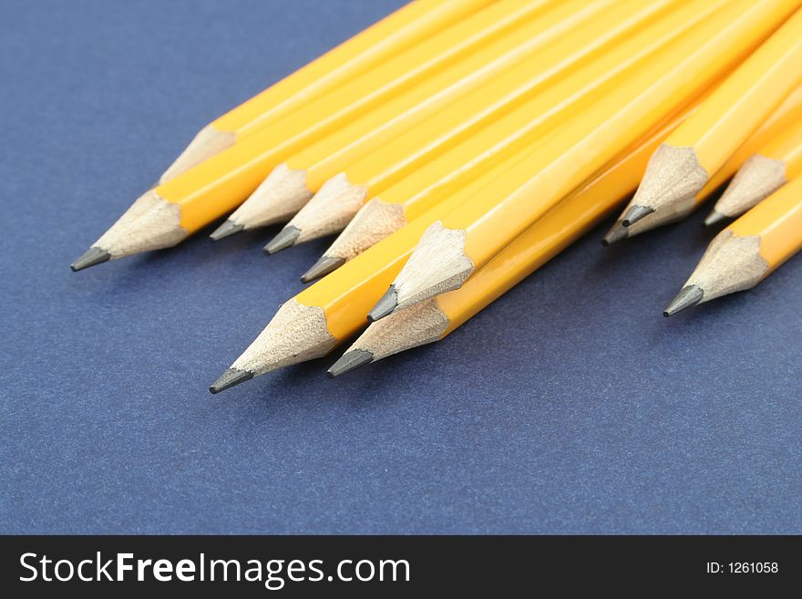 Yellow pencils on a blue background