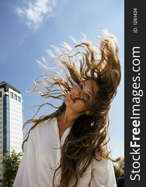 young businesswoman in front of a building. young businesswoman in front of a building