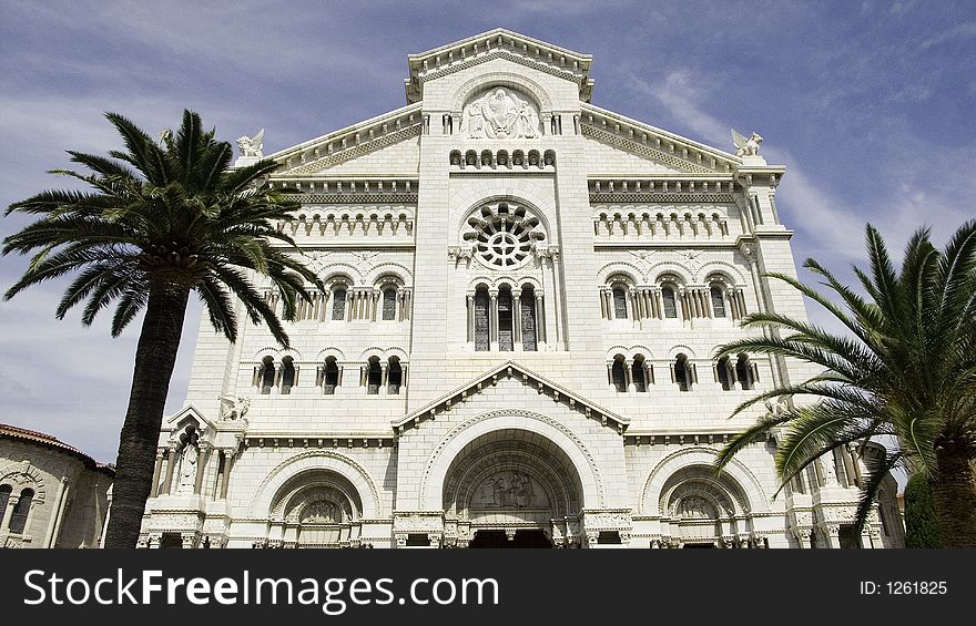 Classic cathedral in monaco with two palm trees. Classic cathedral in monaco with two palm trees