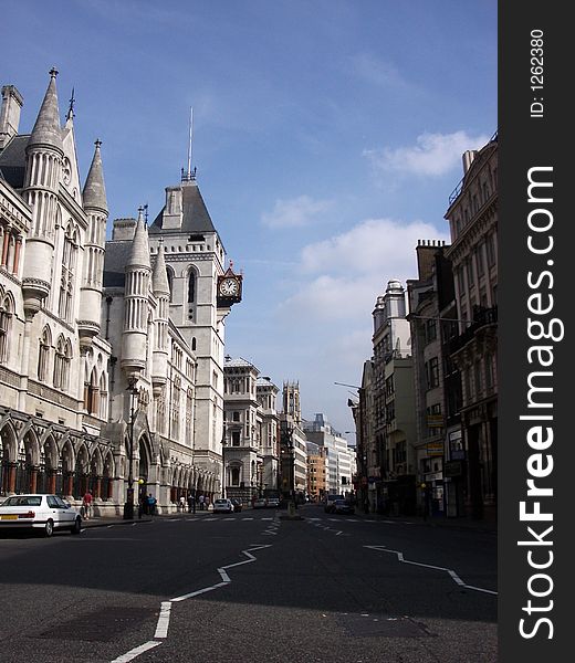 A photograph of the side of the royal courts of justice based in central London if you look you can see a clock in the image. A photograph of the side of the royal courts of justice based in central London if you look you can see a clock in the image.