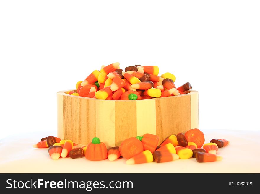 A wooden dish of candy corn for Halloween. A wooden dish of candy corn for Halloween