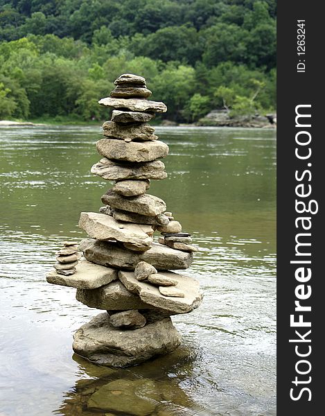 A stack of rocks in a river. A stack of rocks in a river