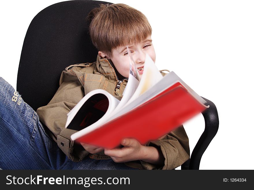 Reading fun boy. Shot in studio. Isolated with clipping path. Reading fun boy. Shot in studio. Isolated with clipping path.
