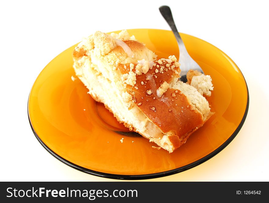 Cake on yellow plate - isolated. Cake on yellow plate - isolated
