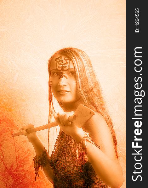 Shot of an girl holding african spear. Shot in studio. Shot of an girl holding african spear. Shot in studio.